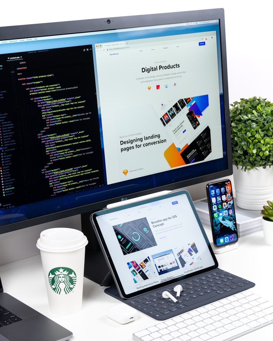 Designer's desk with website layouts on screen